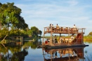 The Queen Sylvia cruises on the Linyanti at Kings Pool, Botswana